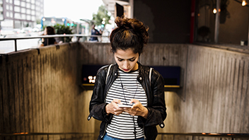 girl-walking-upstairs-with-phone