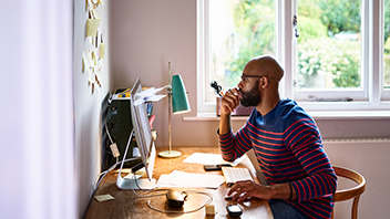 man-works-at-home-office